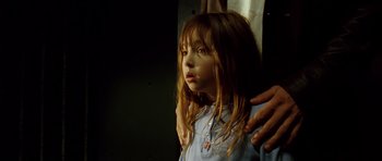 Movie still from “Blade: Trinity” (2004), directed by David S. Goyer – A little girl standing next to a person; Close Up shot, Low angle