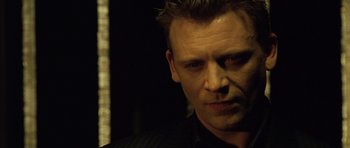 Movie still from “Blade: Trinity” (2004), directed by David S. Goyer – A person wearing a black shirt; Close Up shot, Low angle