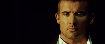 Movie still from “Blade: Trinity” (2004), directed by David S. Goyer – A person wearing a suit and tie; Close Up shot, Low angle