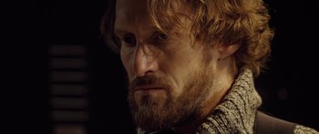 Movie still from “Blade: Trinity” (2004), directed by David S. Goyer – A person with long hair and a beard; Close Up shot, Low angle