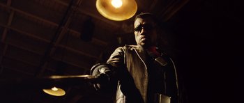 Movie still from “Blade: Trinity” (2004), directed by David S. Goyer – A man holding a baseball bat while wearing a leather jacket; Close Up shot, Low angle