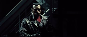 Movie still from “Blade: Trinity” (2004), directed by David S. Goyer – A man in a black leather jacket and sunglasses; Close Up shot, Low angle
