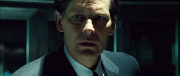 Movie still from “Blade: Trinity” (2004), directed by David S. Goyer – A person wearing a suit and tie; Close Up shot, Low angle