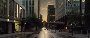 Movie still from “Blade: Trinity” (2004), directed by David S. Goyer – A city street at dusk with cars driving down the street; Extreme Wide shot, High angle