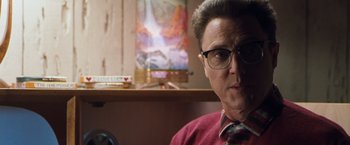 Movie still from “Blast from the Past” (1999), directed by Hugh Wilson – A person wearing glasses; Close Up shot, Over the shoulder angle