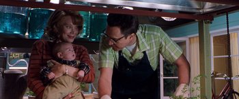 Movie still from “Blast from the Past” (1999), directed by Hugh Wilson – A man and a woman and a baby in a kitchen; Medium shot, Over the shoulder angle