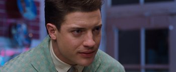 Movie still from “Blast from the Past” (1999), directed by Hugh Wilson – A person wearing a suit and tie; Close Up shot, Over the shoulder angle