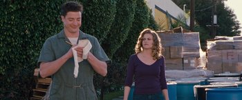 Movie still from “Blast from the Past” (1999), directed by Hugh Wilson – A man and a woman standing next to each other outside; Medium shot, Low angle