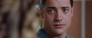 Movie still from “Blast from the Past” (1999), directed by Hugh Wilson – A person looking at the camera; Close Up shot, Over the shoulder angle