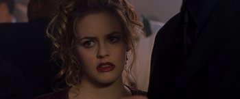 Movie still from “Blast from the Past” (1999), directed by Hugh Wilson – A person wearing a black shirt; Close Up shot, Over the shoulder angle