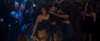 Movie still from “Blast from the Past” (1999), directed by Hugh Wilson – A group of young people dancing in a room; Medium shot, Over the shoulder angle