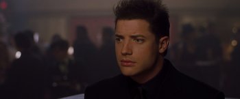 Movie still from “Blast from the Past” (1999), directed by Hugh Wilson – A person wearing a suit and tie; Close Up shot, Low angle