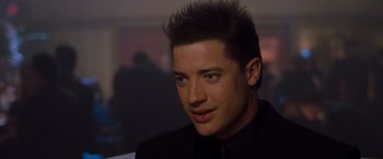 Movie still from “Blast from the Past” (1999), directed by Hugh Wilson – A person wearing a suit and tie; Close Up shot, Over the shoulder angle