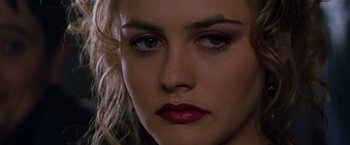 Movie still from “Blast from the Past” (1999), directed by Hugh Wilson – A woman's face with red lipstick; Close Up shot, Over the shoulder angle