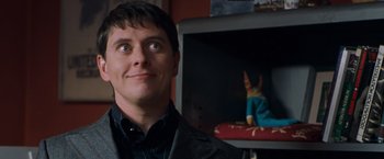 Movie still from “Blast from the Past” (1999), directed by Hugh Wilson – A man standing in front of a fireplace with a cat on the mantle; Close Up shot, Over the shoulder angle