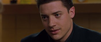 Movie still from “Blast from the Past” (1999), directed by Hugh Wilson – A person wearing a suit and tie; Close Up shot, Over the shoulder angle