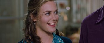 Movie still from “Blast from the Past” (1999), directed by Hugh Wilson – A person smiling; Close Up shot, Over the shoulder angle