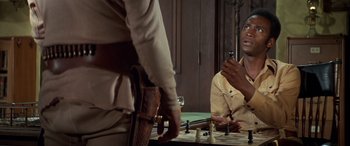 Movie still from “Blazing Saddles” (1974), directed by Mel Brooks – Two men are playing a game of chess; Close Up shot, Over the shoulder angle