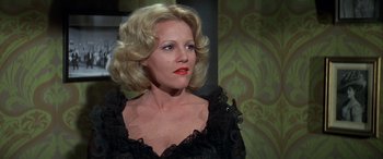 Movie still from “Blazing Saddles” (1974), directed by Mel Brooks – A woman with blonde hair and red lipstick looking to her left; Close Up shot, Low angle