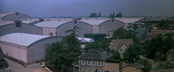 Movie still from “Blazing Saddles” (1974), directed by Mel Brooks – An aerial view of a city with a lot of buildings; Extreme Wide shot, High angle