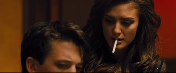 Movie still from “Bleed for This” (2016), directed by Ben Younger – A man and a woman are smoking a cigarette together; Close Up shot, Over the shoulder angle
