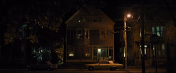 Movie still from “Bleed for This” (2016), directed by Ben Younger – A car parked in front of a house at night; Extreme Wide shot, High angle