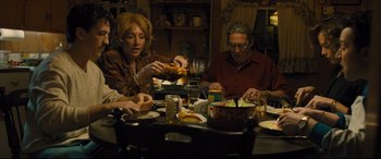 Movie still from “Bleed for This” (2016), directed by Ben Younger – A man and a woman sitting at a dinner table; Medium shot, High angle