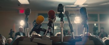 Movie still from “Bleed for This” (2016), directed by Ben Younger – Several microphones are set up on a table; Extreme Close Up shot, Low angle