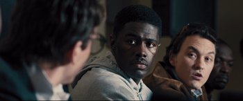 Movie still from “Bleed for This” (2016), directed by Ben Younger – A man with a beard is looking at the camera; Close Up shot, Over the shoulder angle