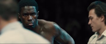 Movie still from “Bleed for This” (2016), directed by Ben Younger – A man in a boxing ring; Close Up shot, Over the shoulder angle