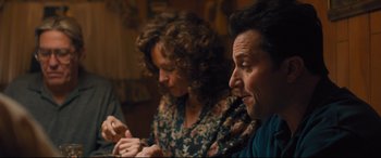 Movie still from “Bleed for This” (2016), directed by Ben Younger – A man and a woman sitting at a dinner table; Medium shot, Over the shoulder angle