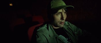 Movie still from “Bleeder” (1999), directed by Nicolas Winding Refn – A person wearing a hat; Close Up shot, High angle