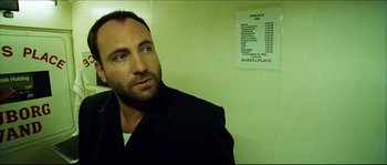 Movie still from “Bleeder” (1999), directed by Nicolas Winding Refn – A person wearing a jacket; Close Up shot, Low angle