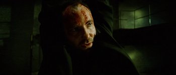 Movie still from “Bleeder” (1999), directed by Nicolas Winding Refn – A person with blood all over his face; Close Up shot, Low angle