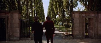 Movie still from “Bleeder” (1999), directed by Nicolas Winding Refn – Two people walking down a street holding hands; Wide shot, Over the shoulder angle