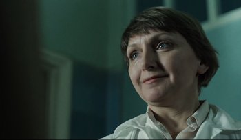 Movie still from “Blind Chance” (1987), directed by Krzysztof Kieslowski – A person with short brown hair; Close Up shot, Low angle