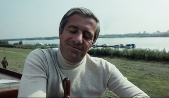 Movie still from “Blind Chance” (1987), directed by Krzysztof Kieslowski – A person holding a stick in his hand; Close Up shot, Low angle