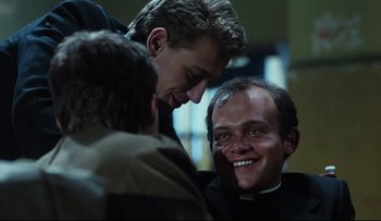 Movie still from “Blind Chance” (1987), directed by Krzysztof Kieslowski – Two men are talking to each other in a room; Close Up shot, Low angle