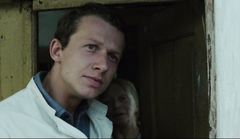 Movie still from “Blind Chance” (1987), directed by Krzysztof Kieslowski – A man and a woman standing next to each other; Close Up shot, Low angle