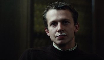 Movie still from “Blind Chance” (1987), directed by Krzysztof Kieslowski – A person wearing a sweater; Close Up shot, Low angle