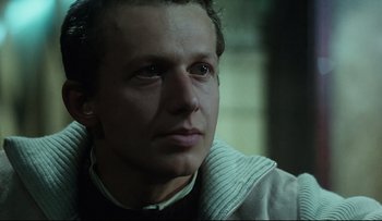 Movie still from “Blind Chance” (1987), directed by Krzysztof Kieslowski – A person looking at the camera; Close Up shot, Low angle