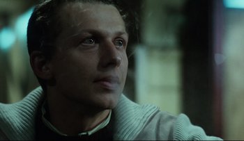 Movie still from “Blind Chance” (1987), directed by Krzysztof Kieslowski – A person looking up at the sky; Close Up shot, Low angle