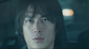 Movie still from “Blindness” (2008), directed by Fernando Meirelles – A person with long hair; Close Up shot, Low angle