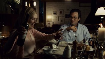 Movie still from “Blindness” (2008), directed by Fernando Meirelles – A man and a woman sitting at a dinner table; Medium shot, Over the shoulder angle