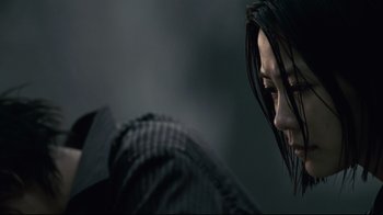 Movie still from “Blindness” (2008), directed by Fernando Meirelles – A person with long black hair; Close Up shot, Low angle