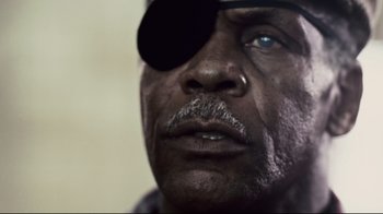 Movie still from “Blindness” (2008), directed by Fernando Meirelles – A person wearing a eye patch; Extreme Close Up shot, Low angle