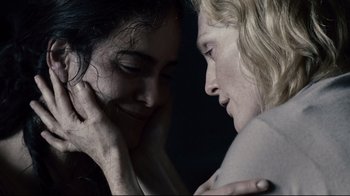 Movie still from “Blindness” (2008), directed by Fernando Meirelles – Two women are looking at one another in the dark; Close Up shot, Overhead angle