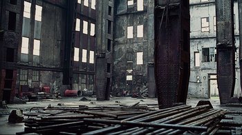 Movie still from “Blindness” (2008), directed by Fernando Meirelles – An old building with many windows and a lot of steel; Extreme Wide shot, Low angle