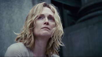 Movie still from “Blindness” (2008), directed by Fernando Meirelles – A person with long blonde hair; Close Up shot, Low angle