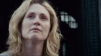Movie still from “Blindness” (2008), directed by Fernando Meirelles – A person with long blonde hair; Close Up shot, Low angle